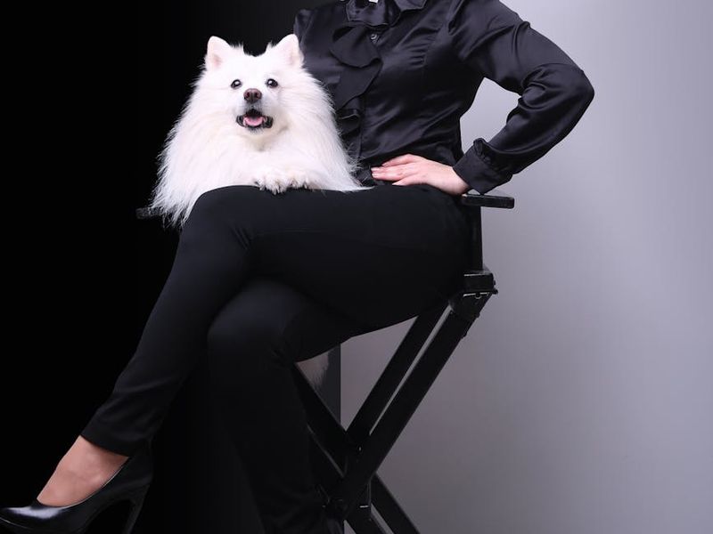 Artistic black and white shot of a woman balancing